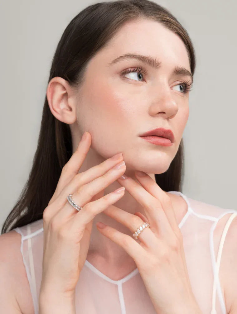Woman wearing "Keanis" diamond rings. Handcrafted fine jewelry detail.