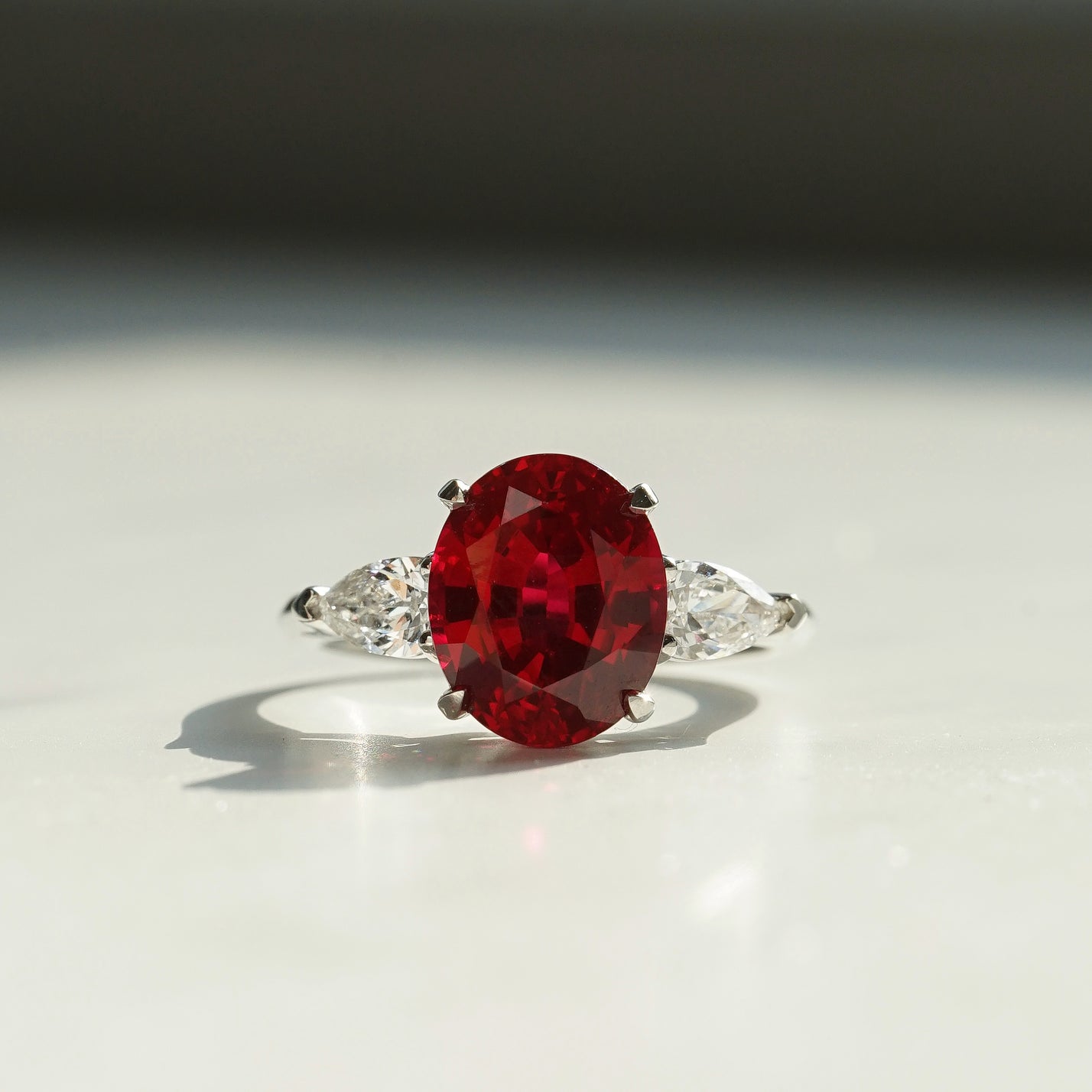 Charlotte, IGI 4.24ct Oval Cut Lab Ruby, PT950 Trilogy Ring