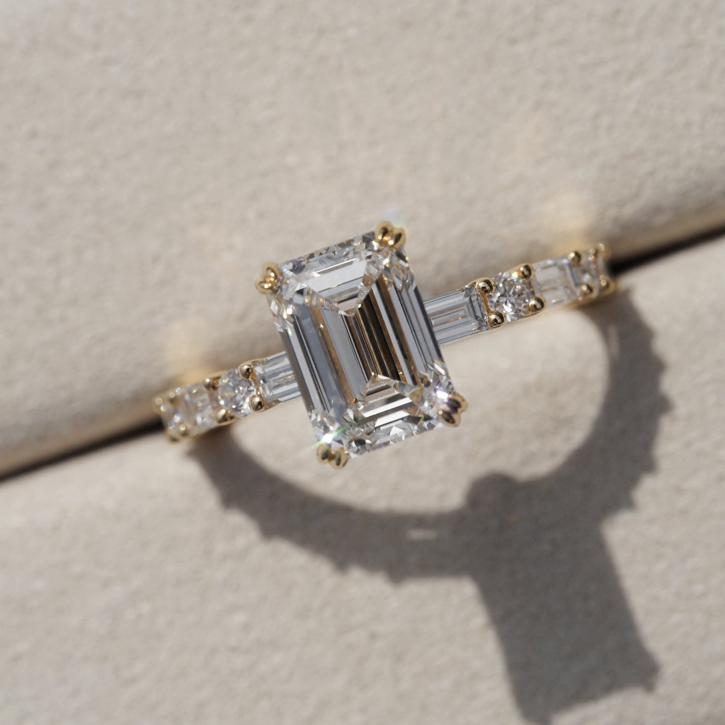 Edith, IGI 2.07ct D VVS2 Emerald Cut Lab Diamond, 18K Yellow Gold Ring with Round & Baguette Pavé