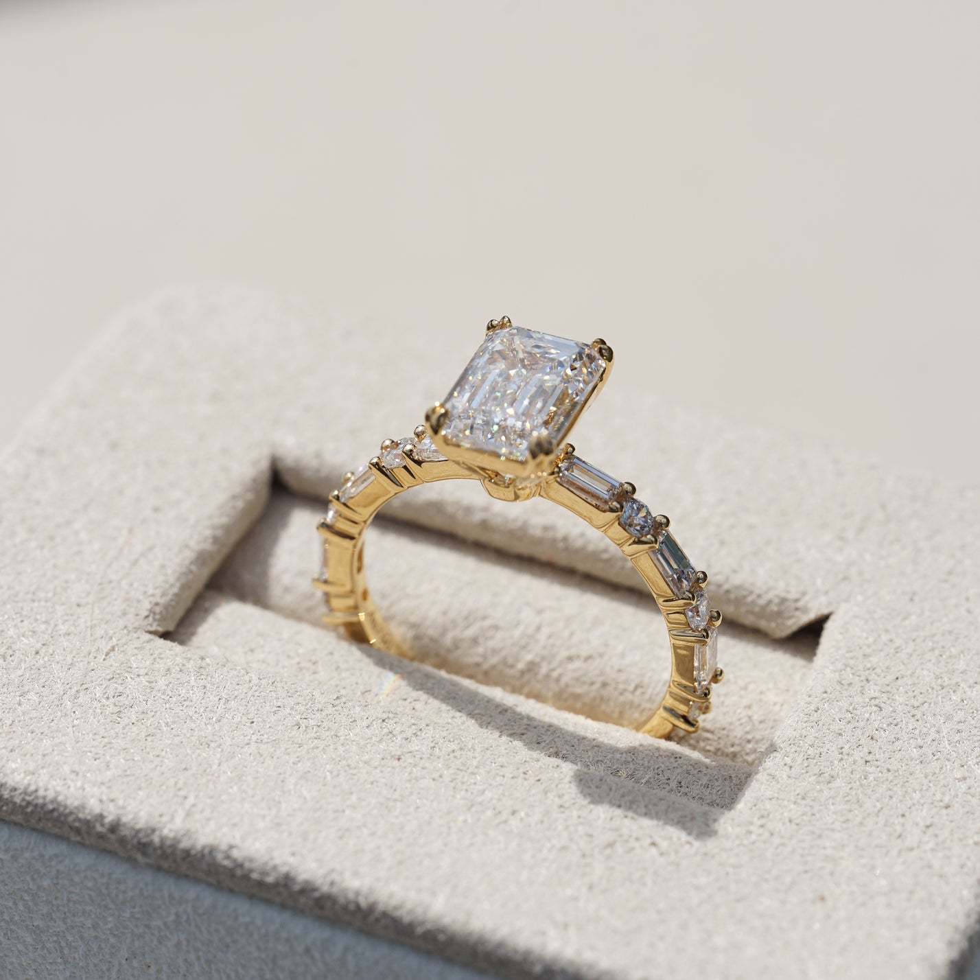 Edith, IGI 2.07ct D VVS2 Emerald Cut Lab Diamond, 18K Yellow Gold Ring with Round & Baguette Pavé