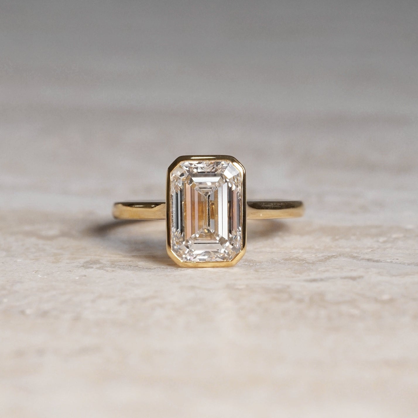 Ellie, IGI 3.08ct Emerald Cut Lab Diamond, 18K Yellow Gold Bezel Solitaire Ring