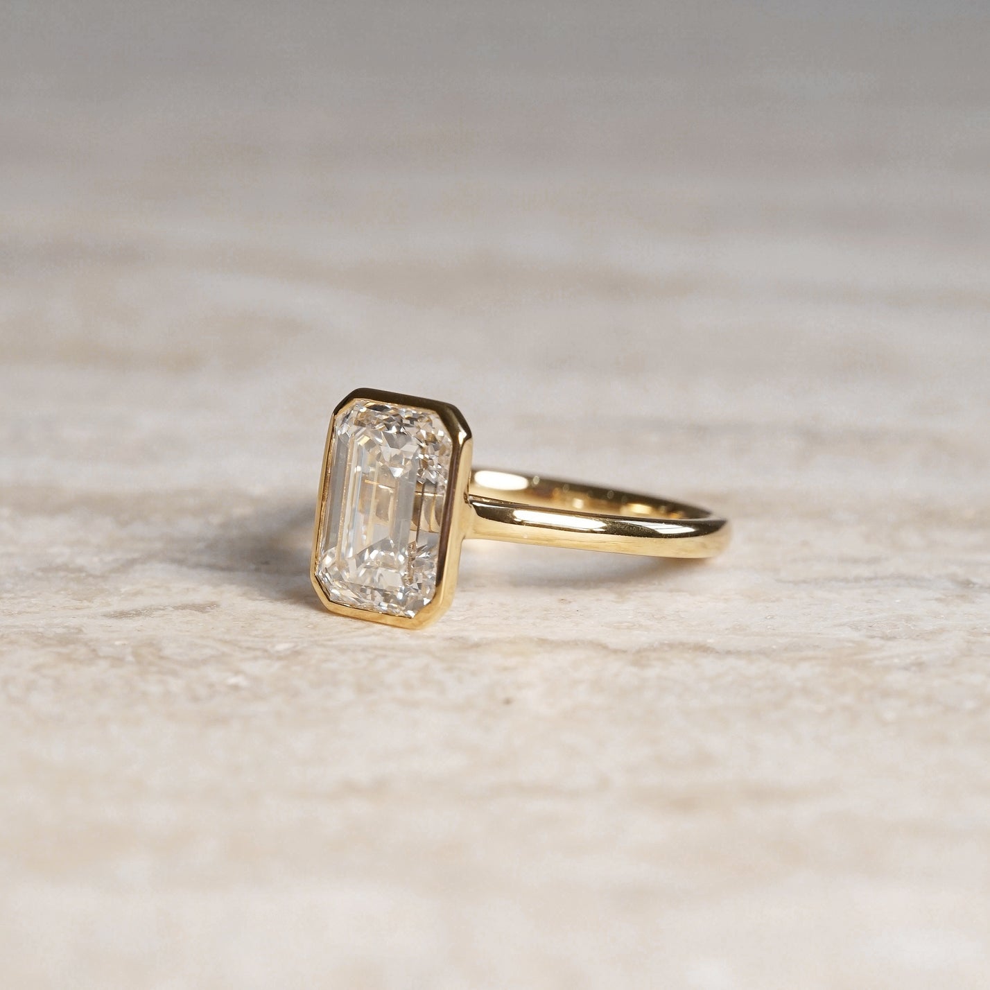 Ellie, IGI 3.08ct Emerald Cut Lab Diamond, 18K Yellow Gold Bezel Solitaire Ring