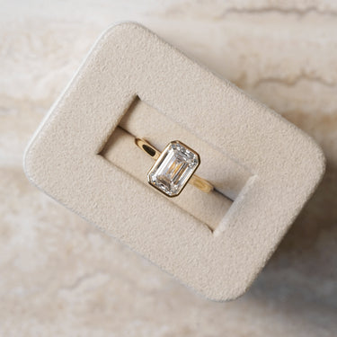 Ellie, IGI 3.08ct Emerald Cut Lab Diamond, 18K Yellow Gold Bezel Solitaire Ring