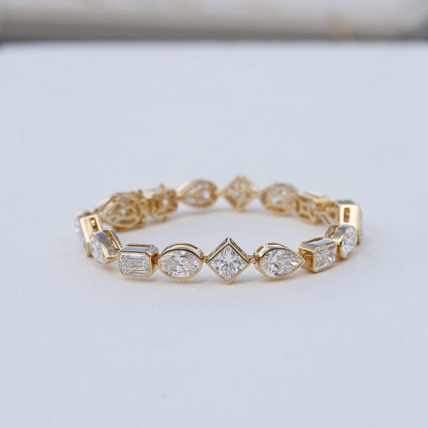 IGI 17.88ct Mixed Fancy Cuts Lab Diamond, 18K Yellow Gold Bezel Tennis Bracelet
