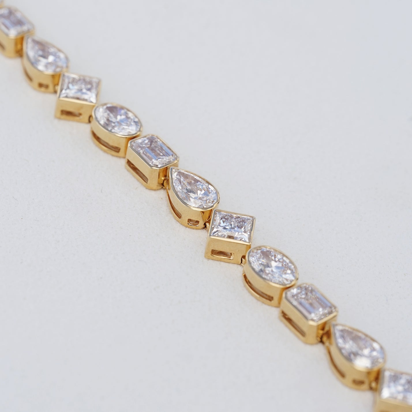 IGI 17.88ct Mixed Fancy Cuts Lab Diamond, 18K Yellow Gold Bezel Tennis Bracelet
