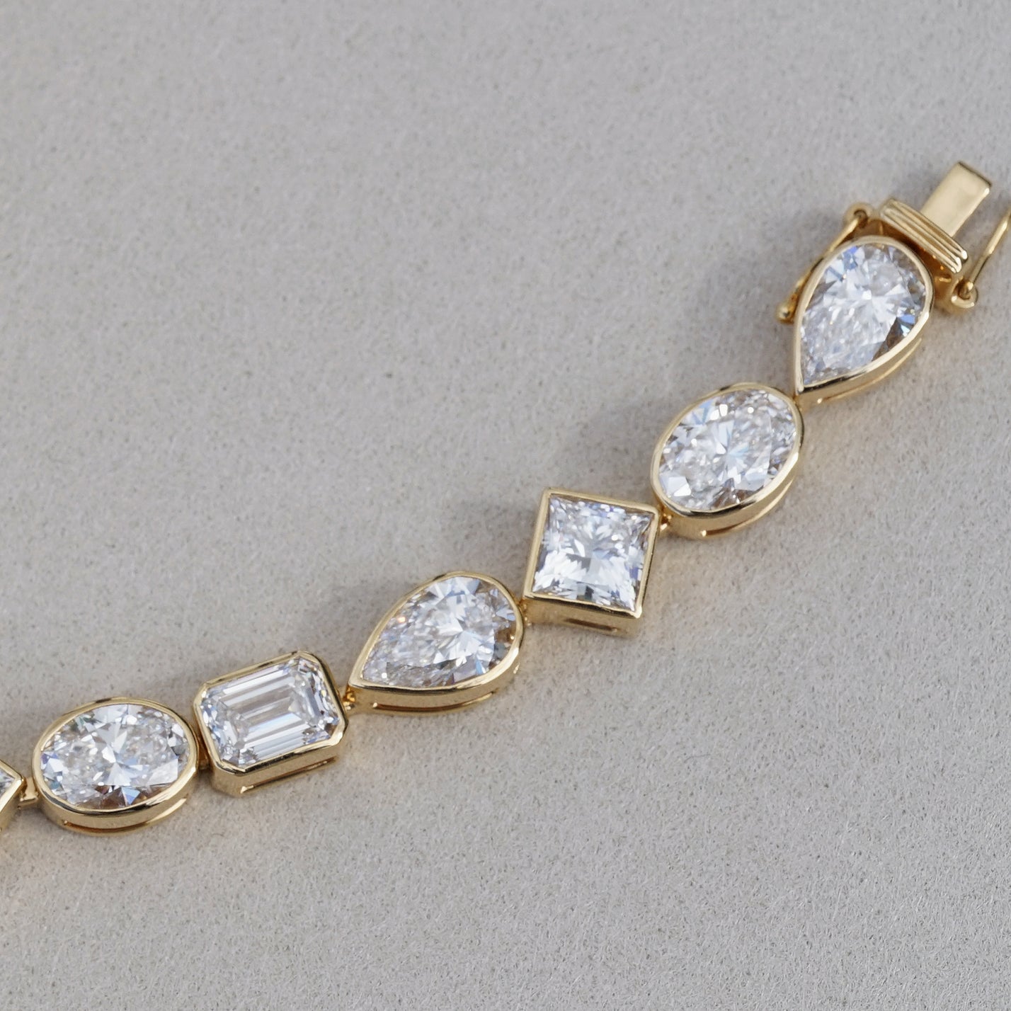 IGI 17.88ct Mixed Fancy Cuts Lab Diamond, 18K Yellow Gold Bezel Tennis Bracelet
