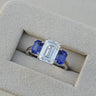 The Promise, IGI 3.09ct D VVS2 Emerald Cut Lab Diamond, PT950 Trilogy Ring with lab Sapphire Accents
