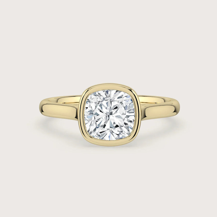 Cushion cut lab-grown diamond solitaire engagement ring, bezel set in 18k yellow gold. "R25201CU" front view.