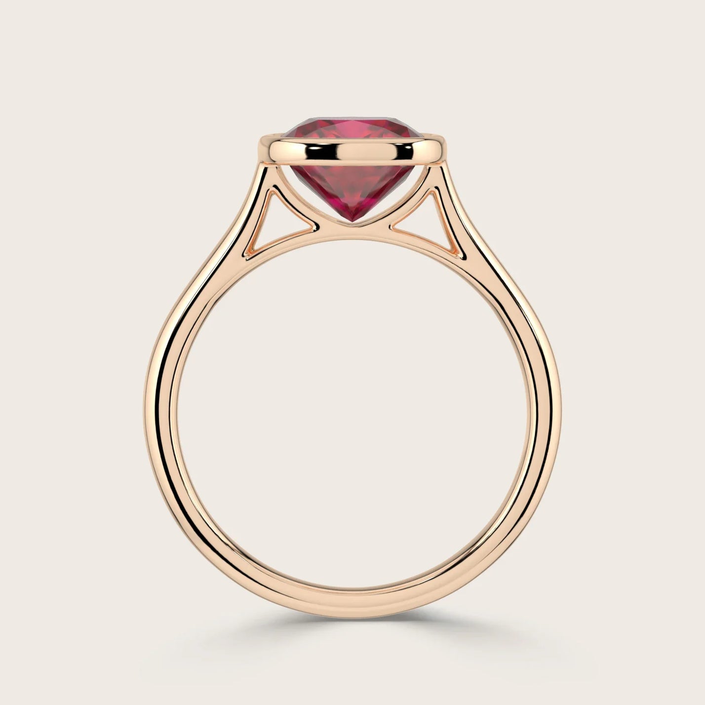 Cushion cut lab-grown ruby solitaire ring, bezel set in 18k rose gold. Side view of "R25201CU.