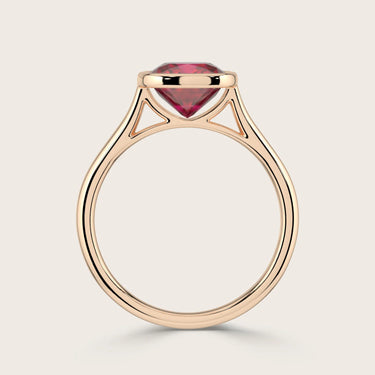 Cushion cut lab-grown ruby solitaire ring, bezel set in 18k rose gold. Side view of "R25201CU.