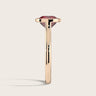 Side view of "Keanis" 18k rose gold solitaire ring. Lab-grown cushion ruby, bezel set.