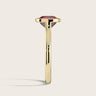 Side view of a lab-grown cushion ruby solitaire ring with a bezel setting in 18k yellow gold. "R25201CU.