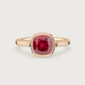 Lab-Grown Cushion Ruby Solitaire" bezel set in an 18k Rose Gold engagement ring.