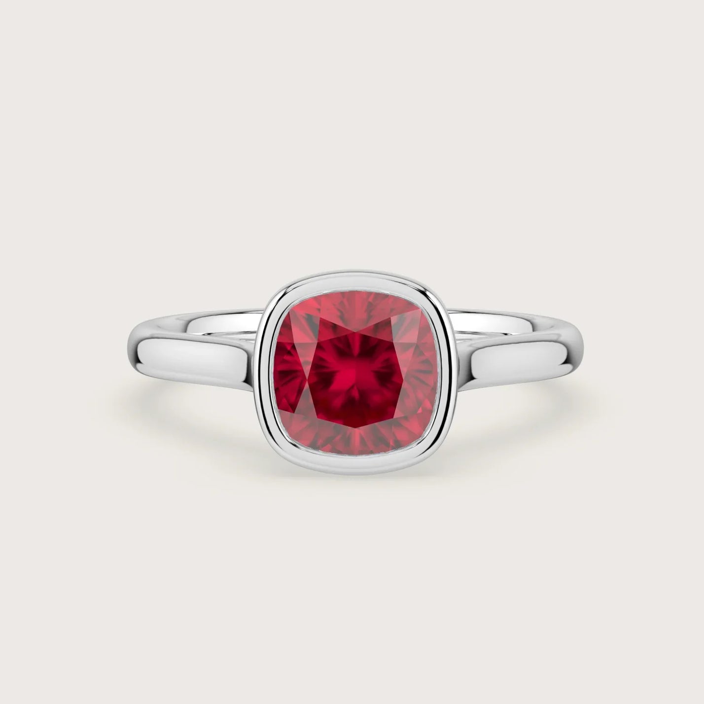 Cushion" lab-grown ruby solitaire ring. 18k white gold bezel setting, elegant engagement ring.
