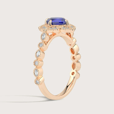 Rose gold ring with cushion-cut lab-grown sapphire, diamond halo and band. "R25307CUHA" style.