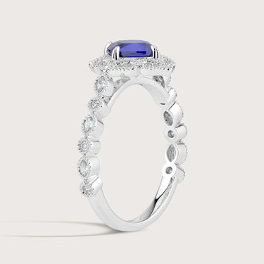 Lab-grown cushion sapphire ring in 18k white gold with diamond halo and band. "R25307CUHA" detail.