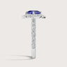 Lab-grown "cushion sapphire" ring. Halo setting with diamond band in 18k white gold. Side view.
