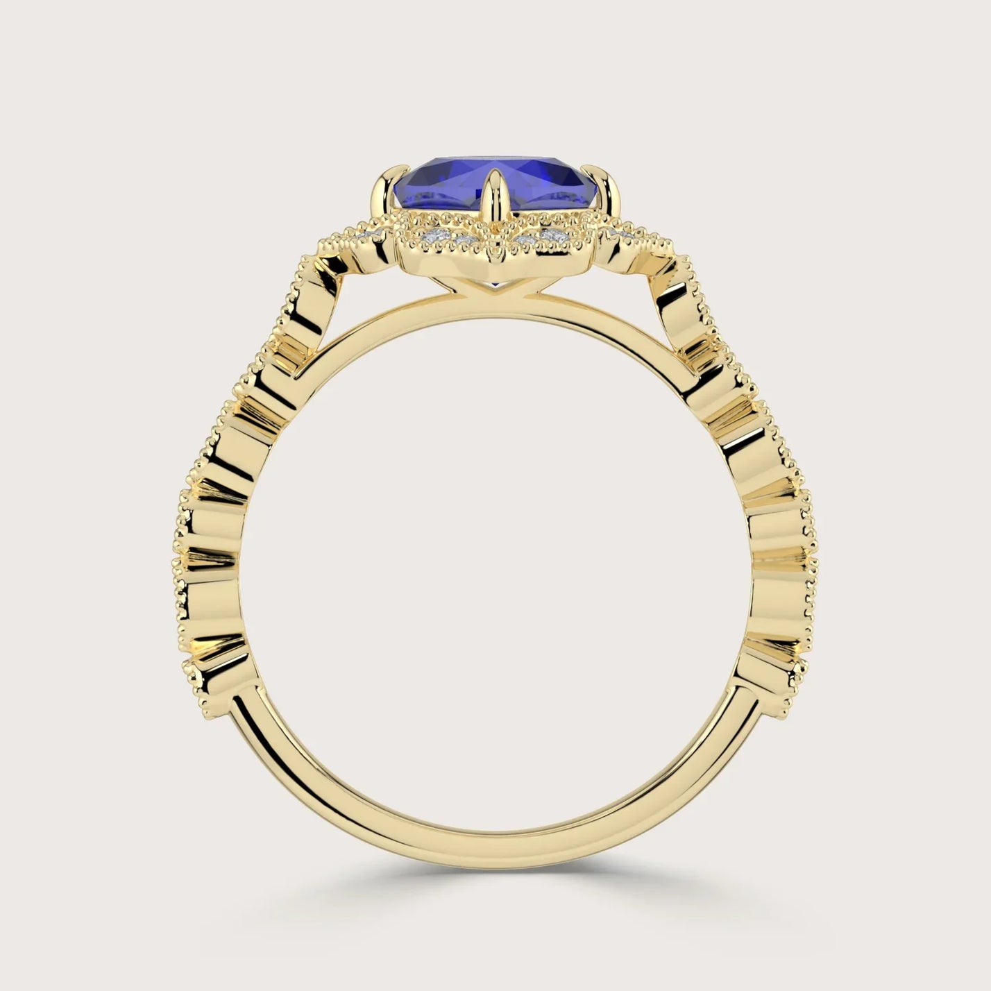Side view of "R25307CUHA" 18k yellow gold ring with cushion-cut lab-grown sapphire and diamond halo band.