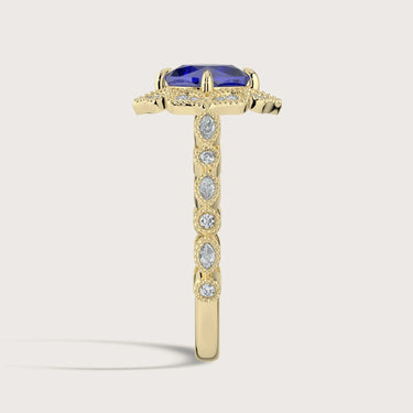 Side view of "lab-grown cushion sapphire" ring, halo setting, diamond gold band.