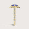 Side view of "lab-grown cushion sapphire" ring, halo setting, diamond gold band.