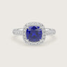 Lab-grown cushion sapphire engagement ring. Diamond halo and band in 18k white gold. "R24818CUHA.