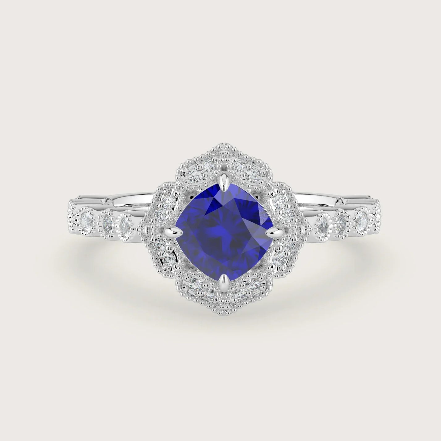 Lab-grown cushion sapphire engagement ring with diamond halo and band in 18k white gold. "R25307CUHA" style.