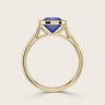 Side view of "lab-grown cushion sapphire" solitaire ring. Bezel set in 18k yellow gold.