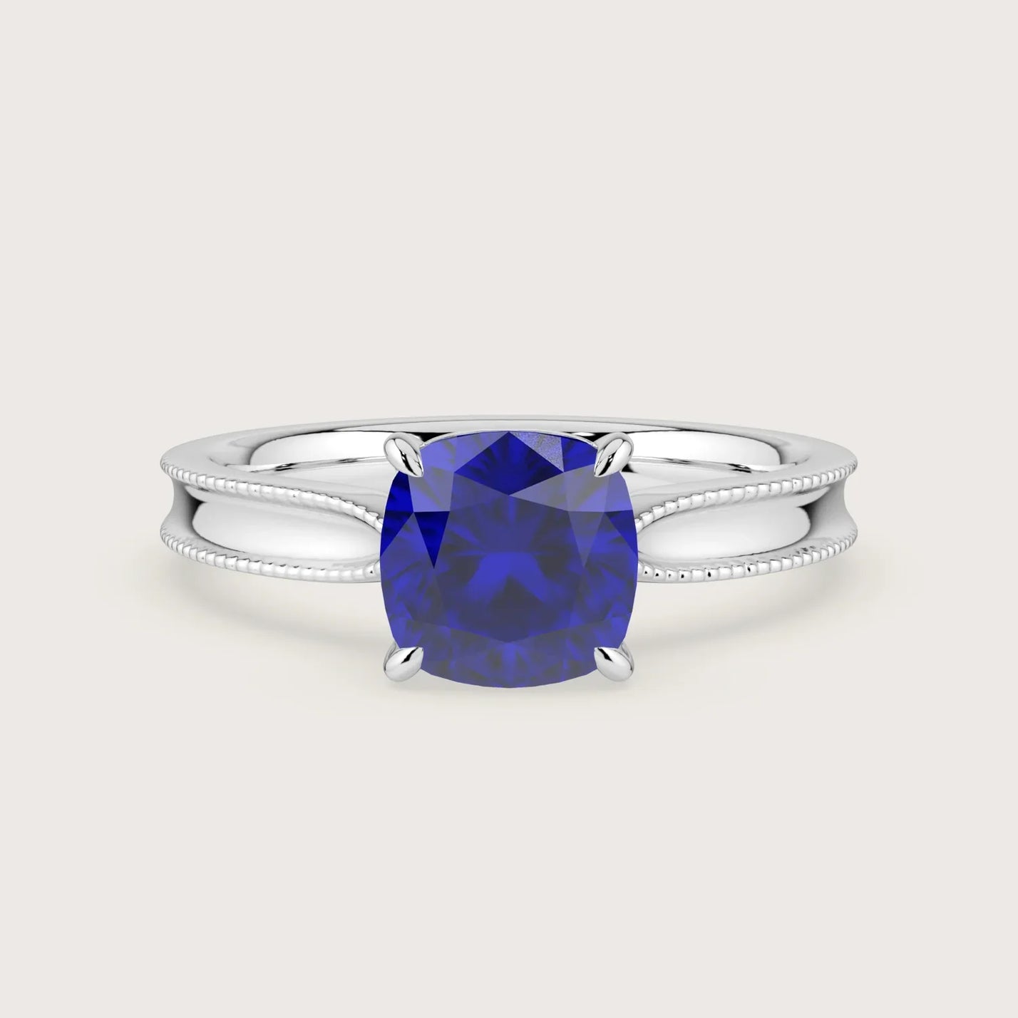 Lab-grown cushion sapphire solitaire engagement ring. 18k white gold with milgrain detailing. "R24821CU.