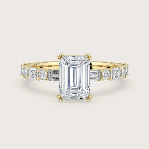 Lab-grown "emerald cut" diamond engagement ring. 18k yellow gold band with baguette and round diamonds.