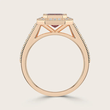 Rose gold ring with "lab-grown emerald", ruby halo, milgrain detail, and vintage diamond band.