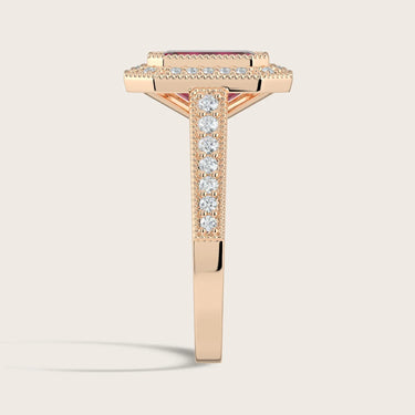 Side view of "lab-grown emerald ruby" ring in 18k rose gold with diamond halo and milgrain vintage band.
