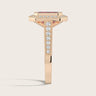 Side view of "lab-grown emerald ruby" ring in 18k rose gold with diamond halo and milgrain vintage band.