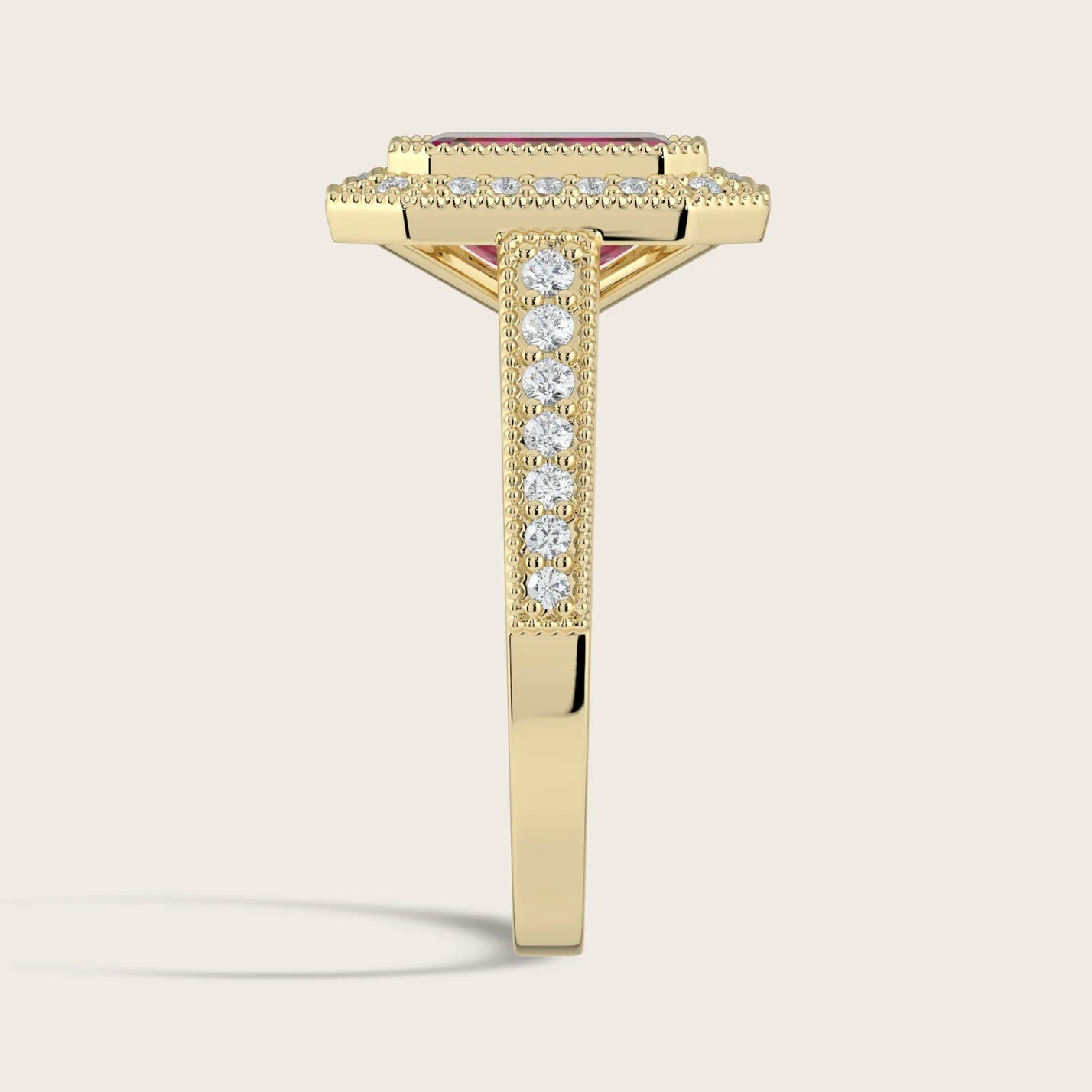 18k yellow gold vintage-style engagement ring side view showing diamond-studded band with milgrain detailing and emerald-cut ruby halo setting