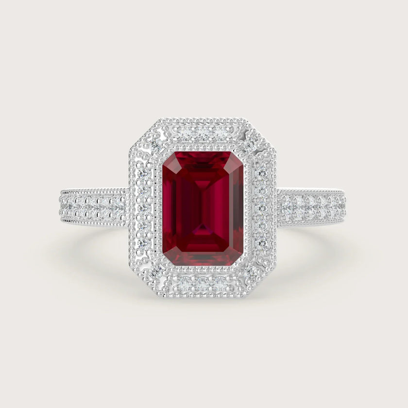 Lab-grown" ruby engagement ring. Emerald cut, halo setting, milgrain detail, vintage band, 18k white gold.