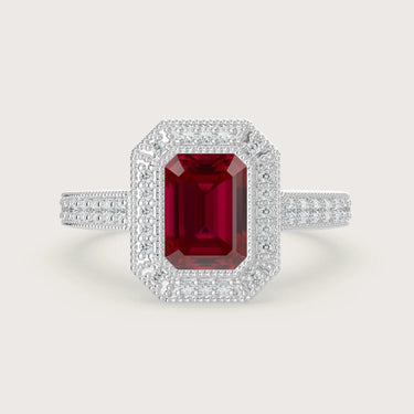 Lab-grown" ruby engagement ring. Emerald cut, halo setting, milgrain detail, vintage band, 18k white gold.