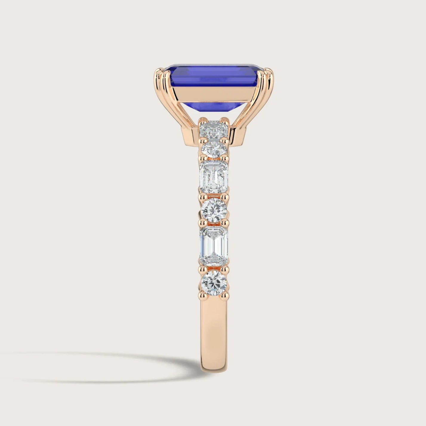 Side view of "R24831EMA" 18k rose gold ring with lab-grown sapphire and diamond band from Keanis.co.uk.