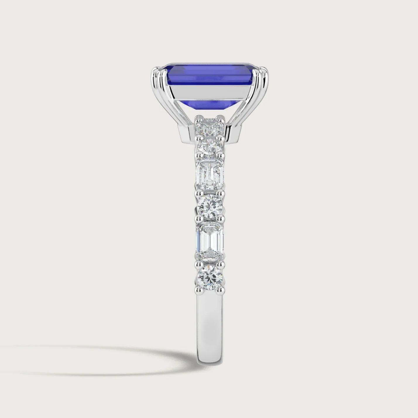 Side view of "R24831EMA" 18k white gold ring with lab-grown sapphire and diamond band.