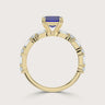 Lab-grown sapphire ring in 18k yellow gold with diamond accents, "R24831EMA". Side view showcasing the band's details.