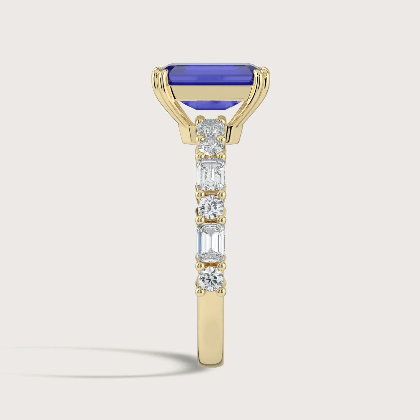 Lab-grown sapphire ring in 18k yellow gold, "R24831EMA," with diamond accents. Side view.