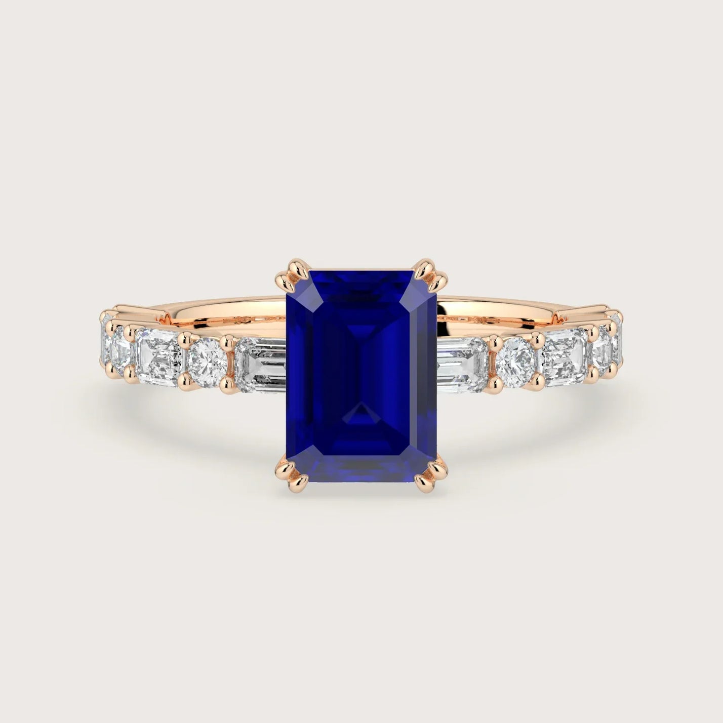Lab Grown" sapphire engagement ring. Emerald cut stone, diamond band, 18k rose gold setting.