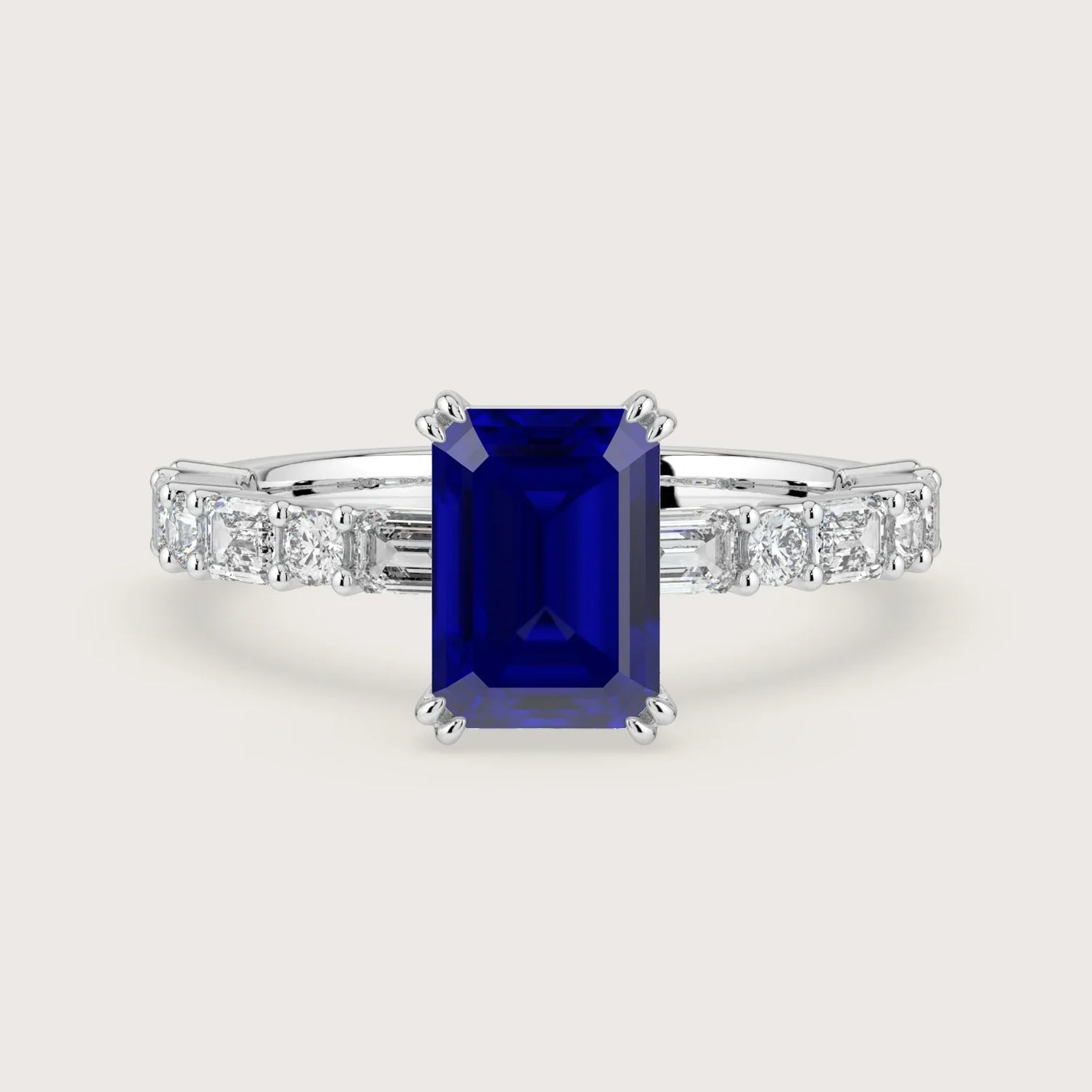 18k white gold engagement ring with sapphire "emerald" cut center stone and diamond band.