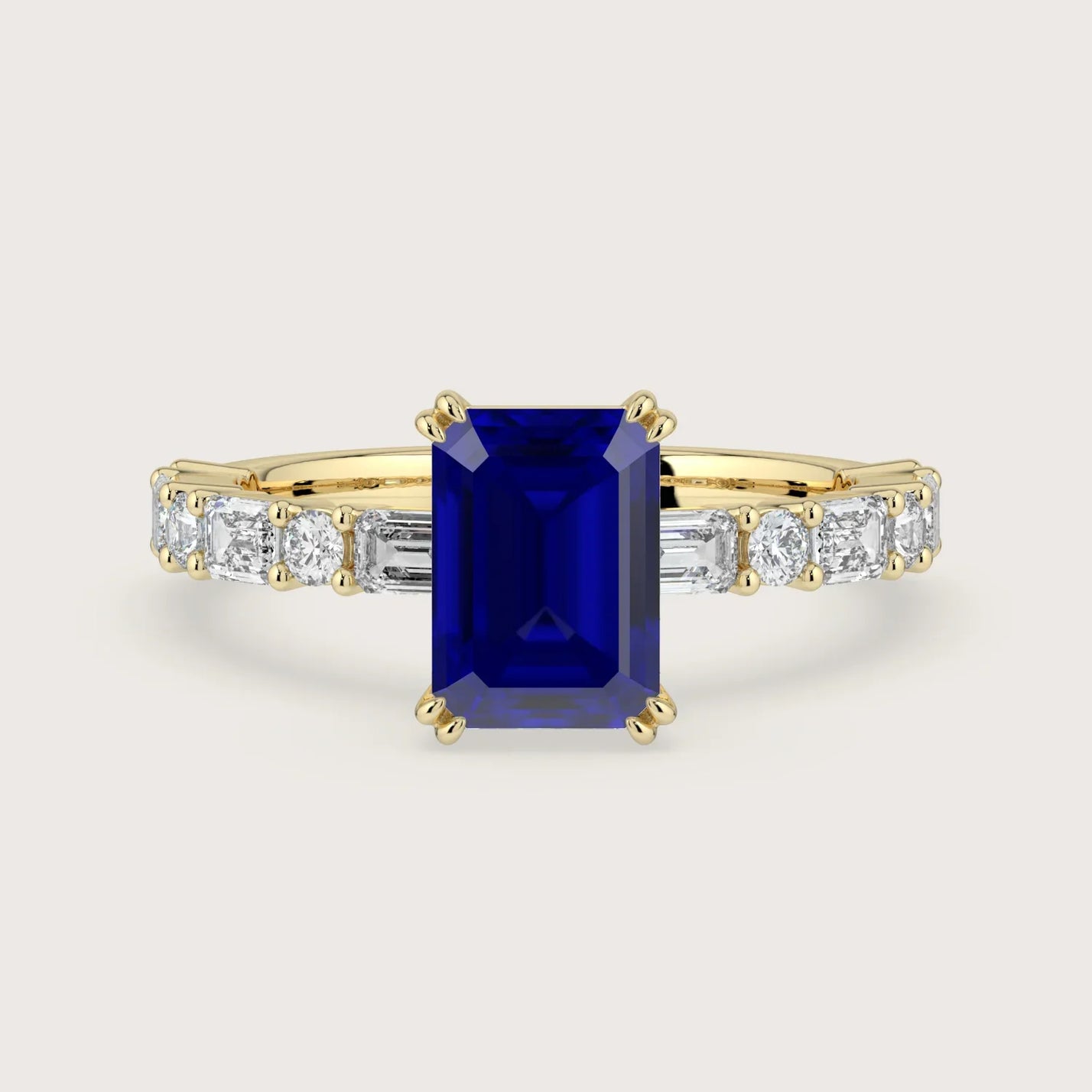 18k yellow gold ring with a lab-grown emerald cut sapphire center stone and diamond band. "R24831EMA.