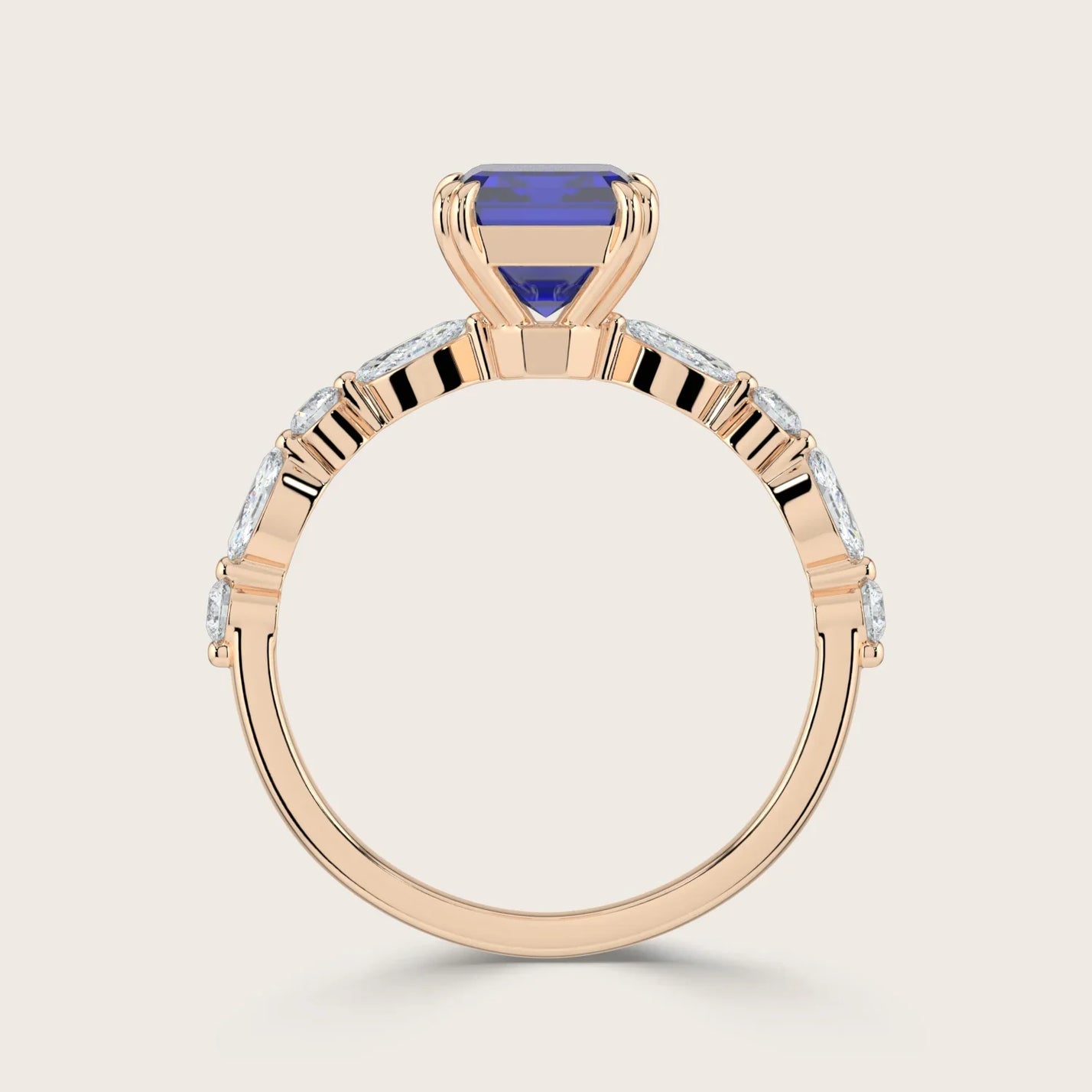 Rose gold ring with lab-grown blue sapphire and marquise diamonds. "R24837EMA" detail.