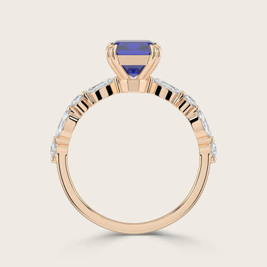 Rose gold ring with lab-grown blue sapphire and marquise diamonds. "R24837EMA" detail.