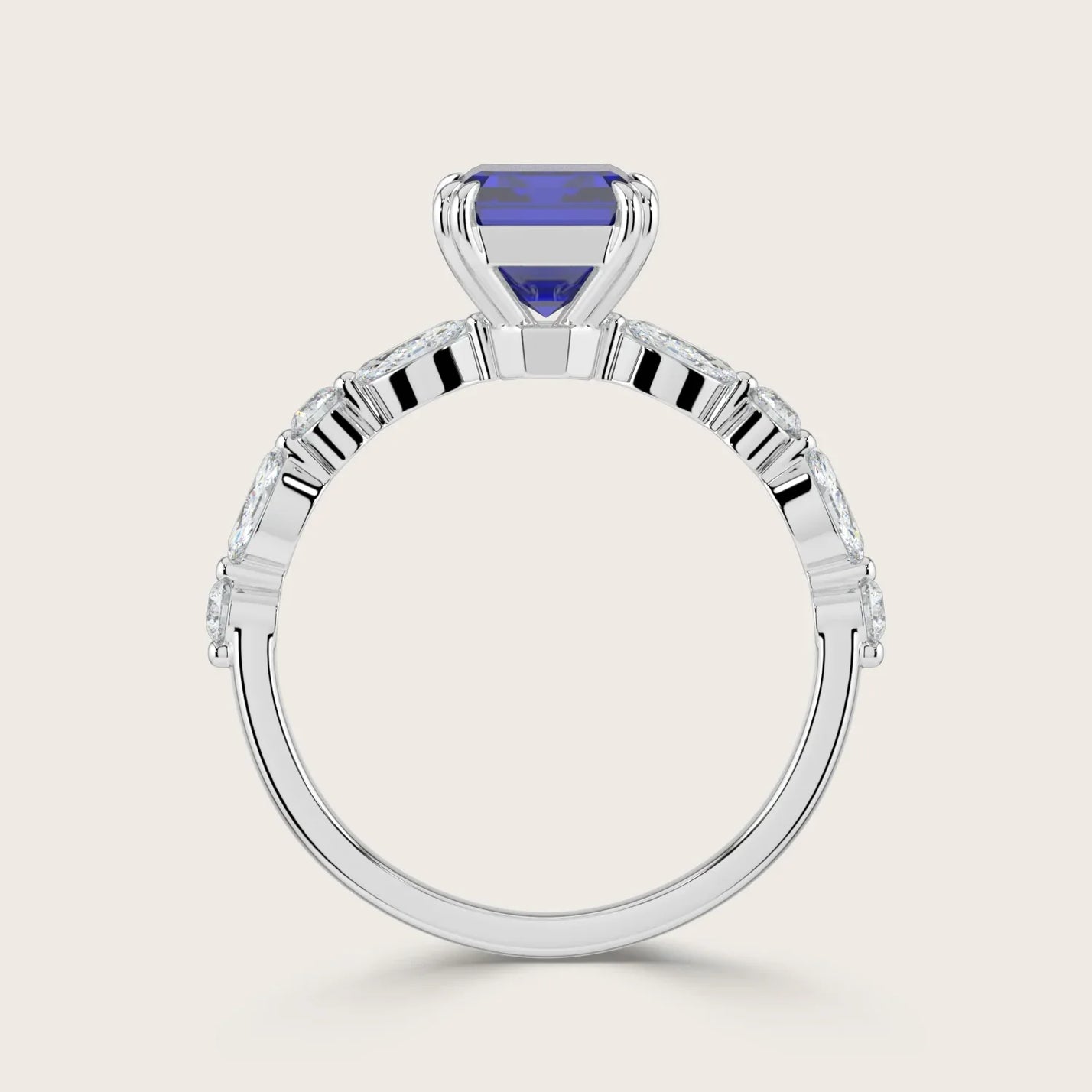 Lab-grown sapphire ring in 18k white gold. Features marquise and round diamond band. "R24837EMA" model.