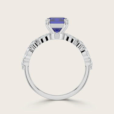 Lab-grown sapphire ring in 18k white gold. Features marquise and round diamond band. "R24837EMA" model.