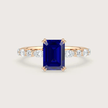 Rose gold engagement ring with lab-grown sapphire center stone and diamond accents. "R24837EMA" style.