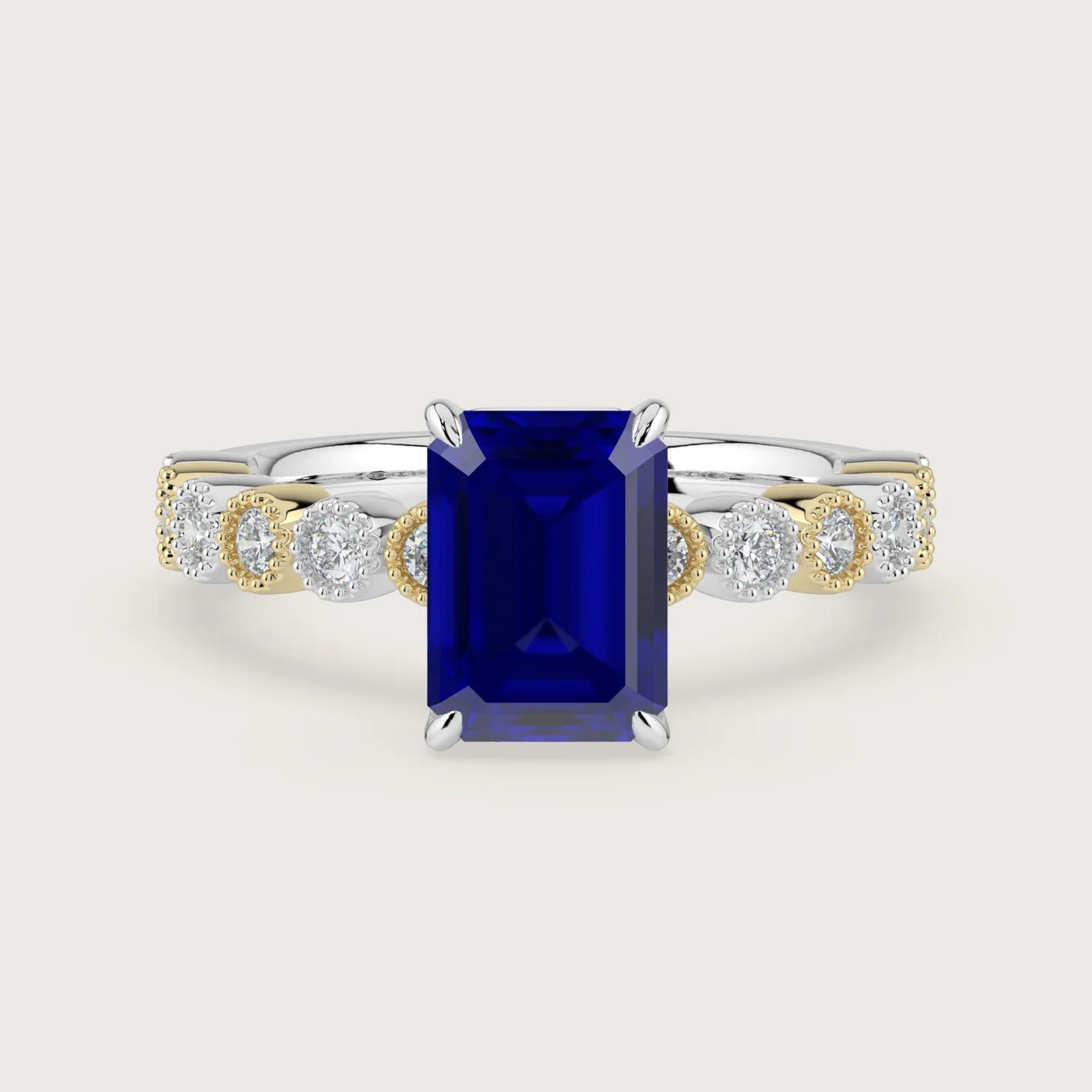 Lab-grown emerald-cut sapphire engagement ring. "Milgrain Vintage" two-tone 18k gold band with diamonds.