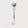 Side view of "R25201EM" lab-grown sapphire solitaire ring. Half bezel setting, 18k white gold band.