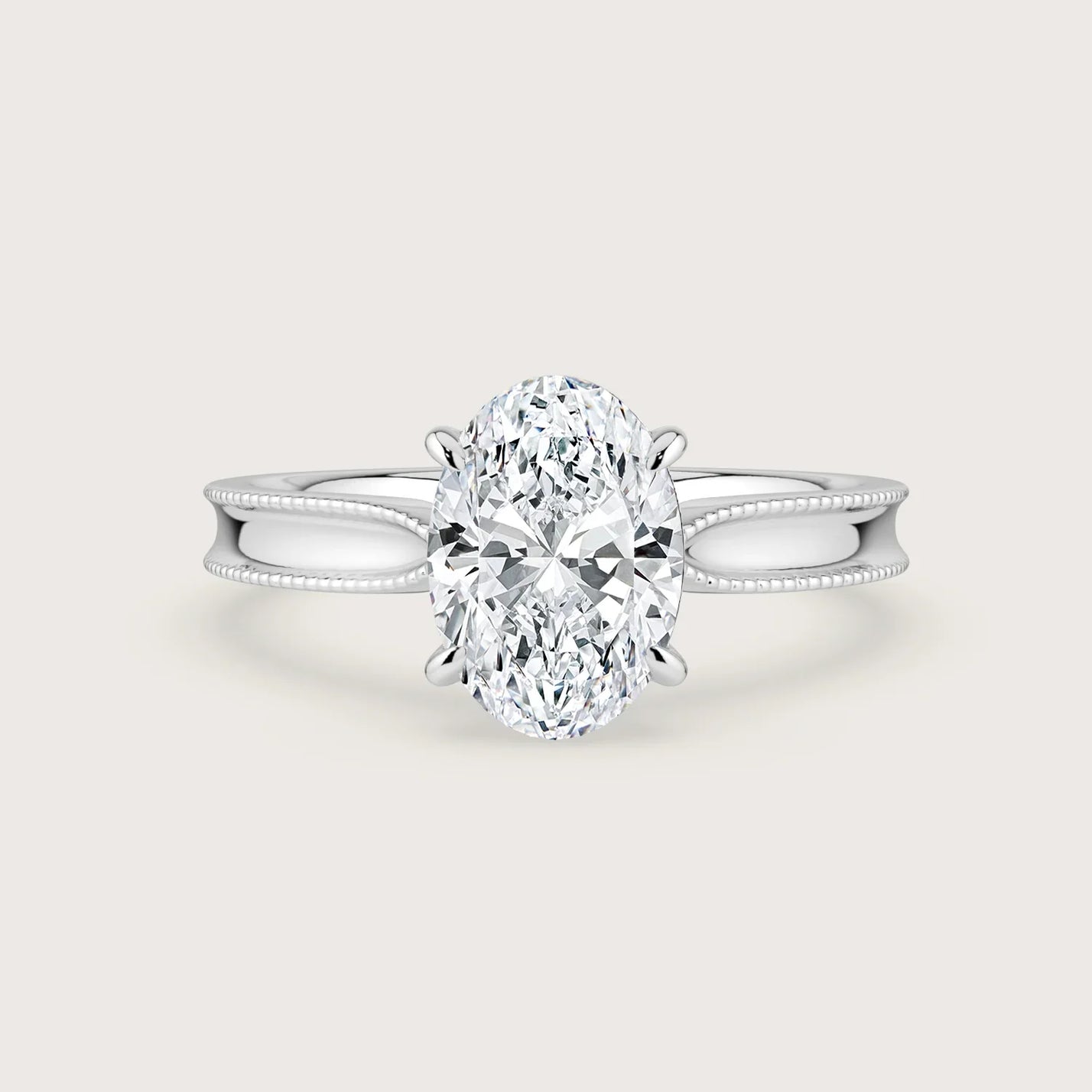 Oval lab-grown diamond solitaire engagement ring in 18k white gold with milgrain detailing. "R24821OV.